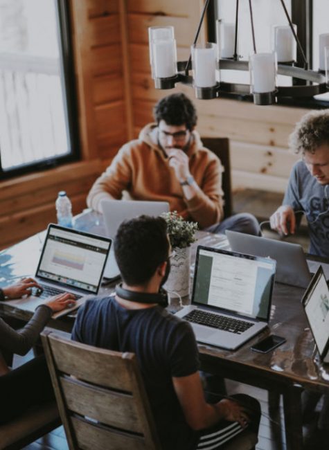 A group of friends co-working in a community space