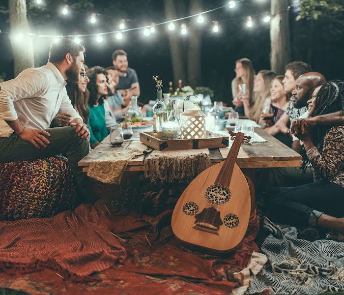 Community dinner outside in moonshine